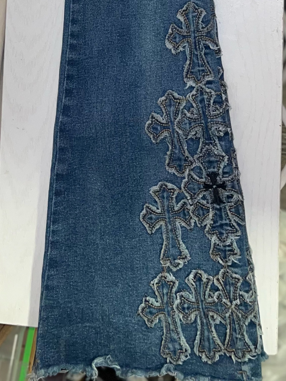 Blue Denim jeans with cross detail